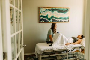 Pelvic floor physical therapist at UpLift in San Antonio guiding a woman through urinary incontinence physical therapy exercises